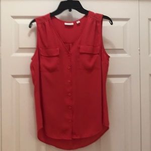 Sleeveless blouse. Orange/dark peach